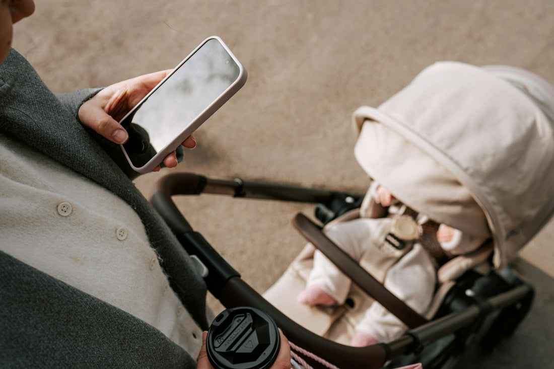 pram phone mounts with parent handheld use on walks